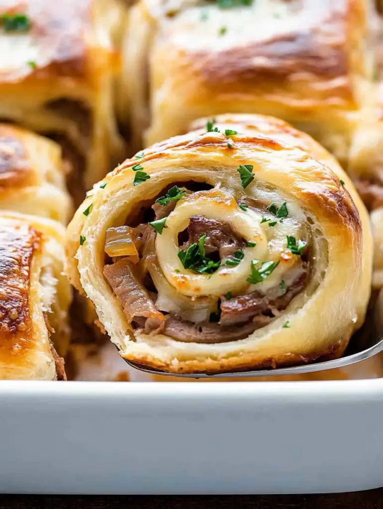 Close Up of a Caramelized Onion Roast Beef Roll Being Served