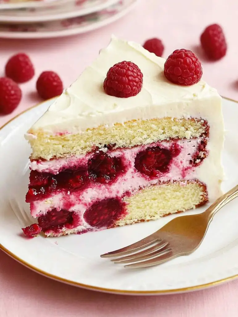 Close Up of a Slice of White Chocolate Raspberry Cake